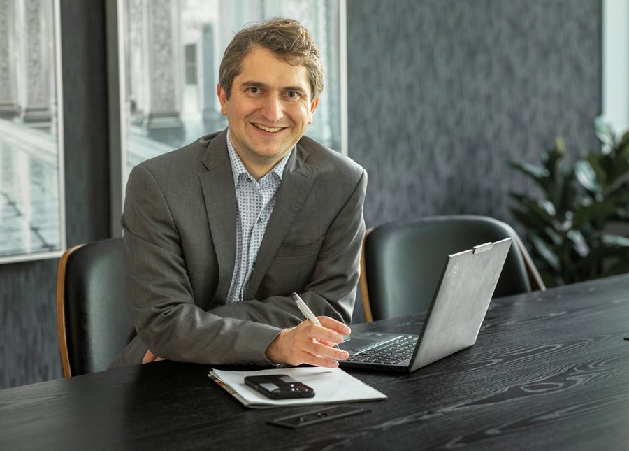 Mathew Eardley, Founder and Advisor at Koinos Financial, at his desk
